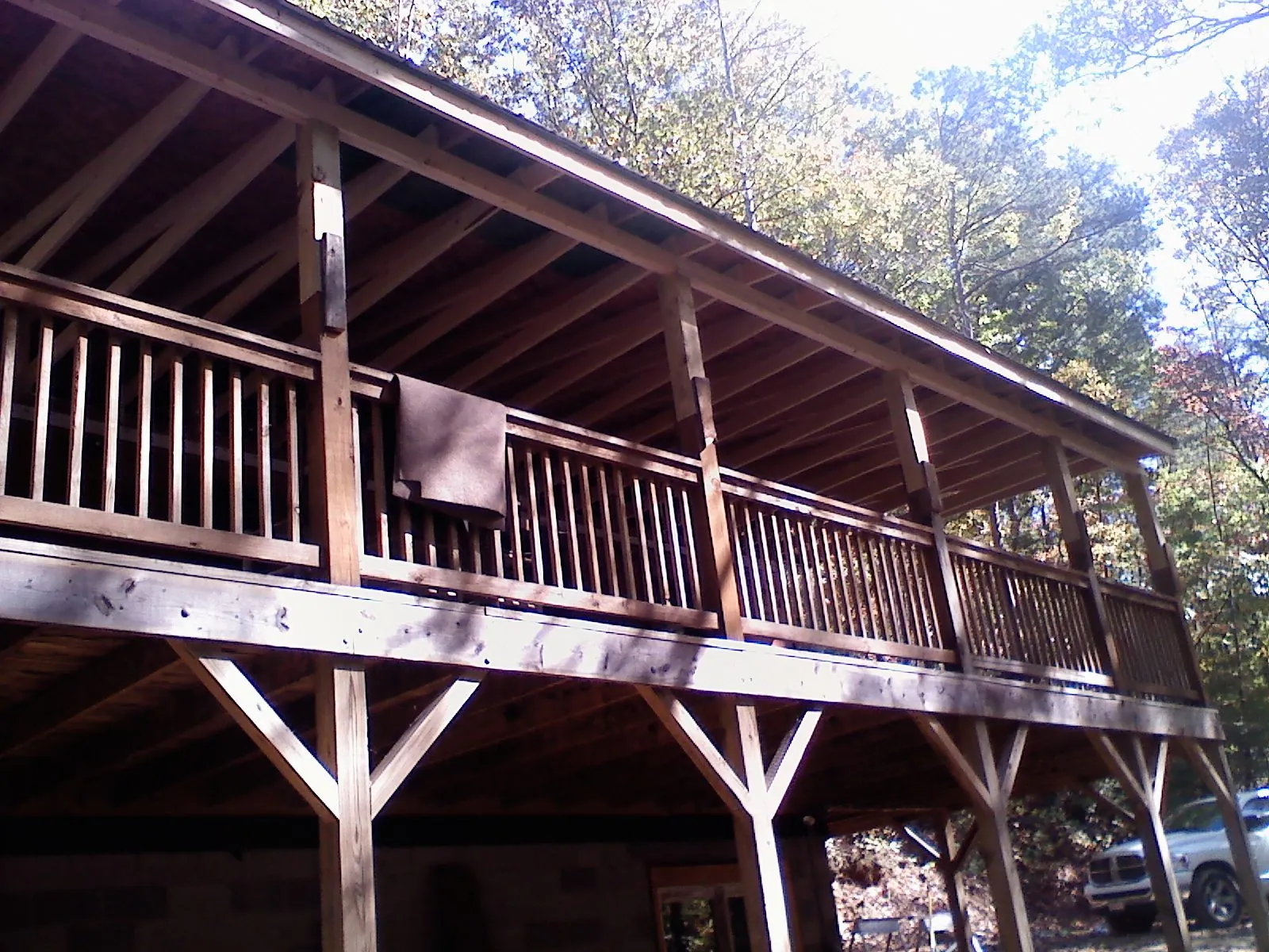 Timber framing under a new elevated porch and deck — Roof Leak Repair in Colonia by Roofing Brothers
